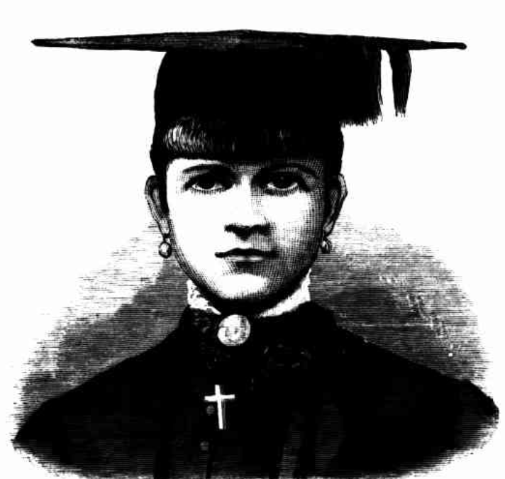 A woman wearing a high-necked black dress with lace collar and a choker, with a cross pinned to her chest, faces the camera. She is wearing a mortarboard to signal she is a university graduate.